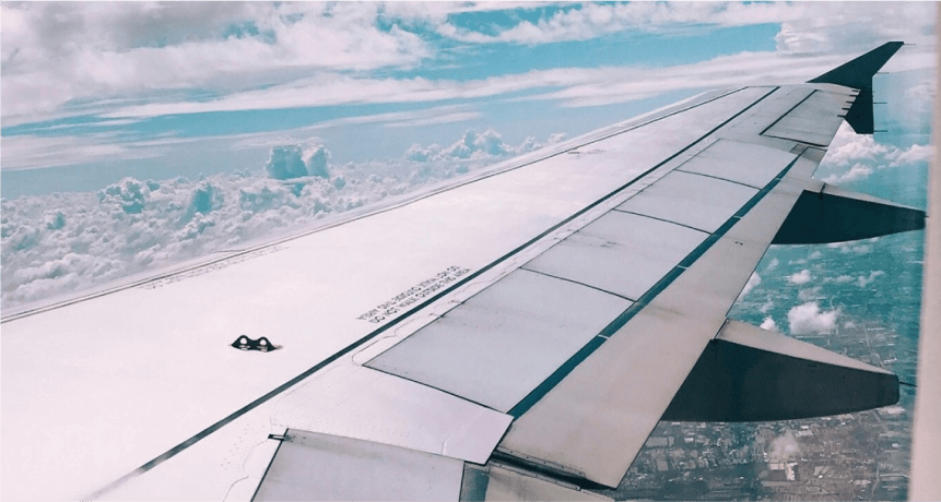 view of airplane wing from inside plane